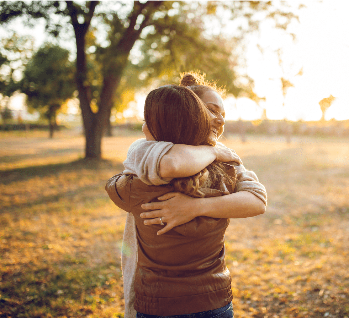 Photo of two people showing support